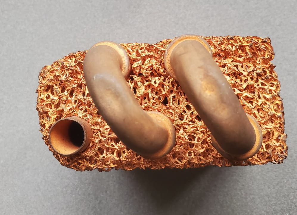 Metal foam heat exchanger with aluminum foam — 15x heat transfer coefficient enhancement vs plain tube